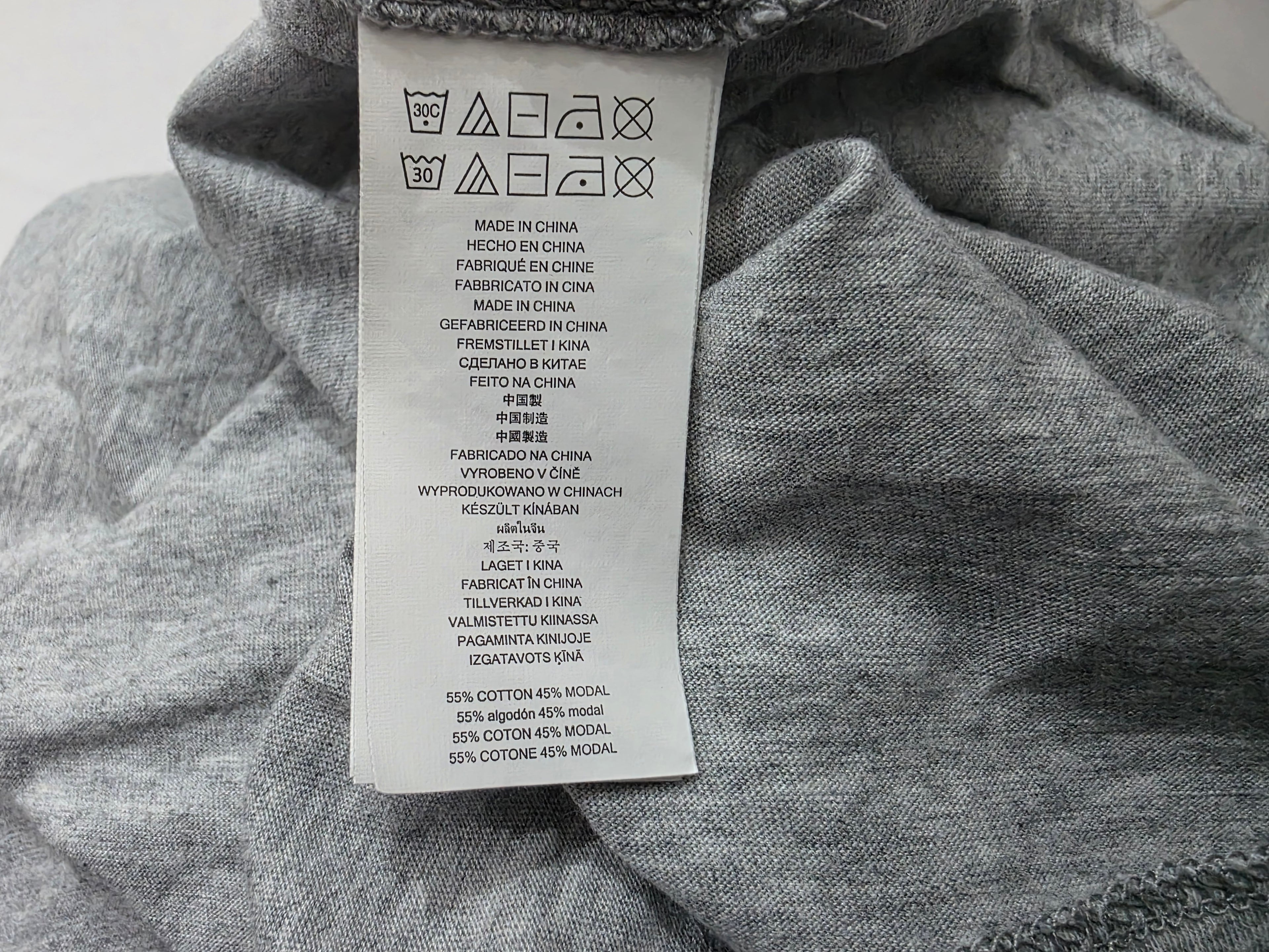 Blusa Michael Kors color gris con olan manga larga