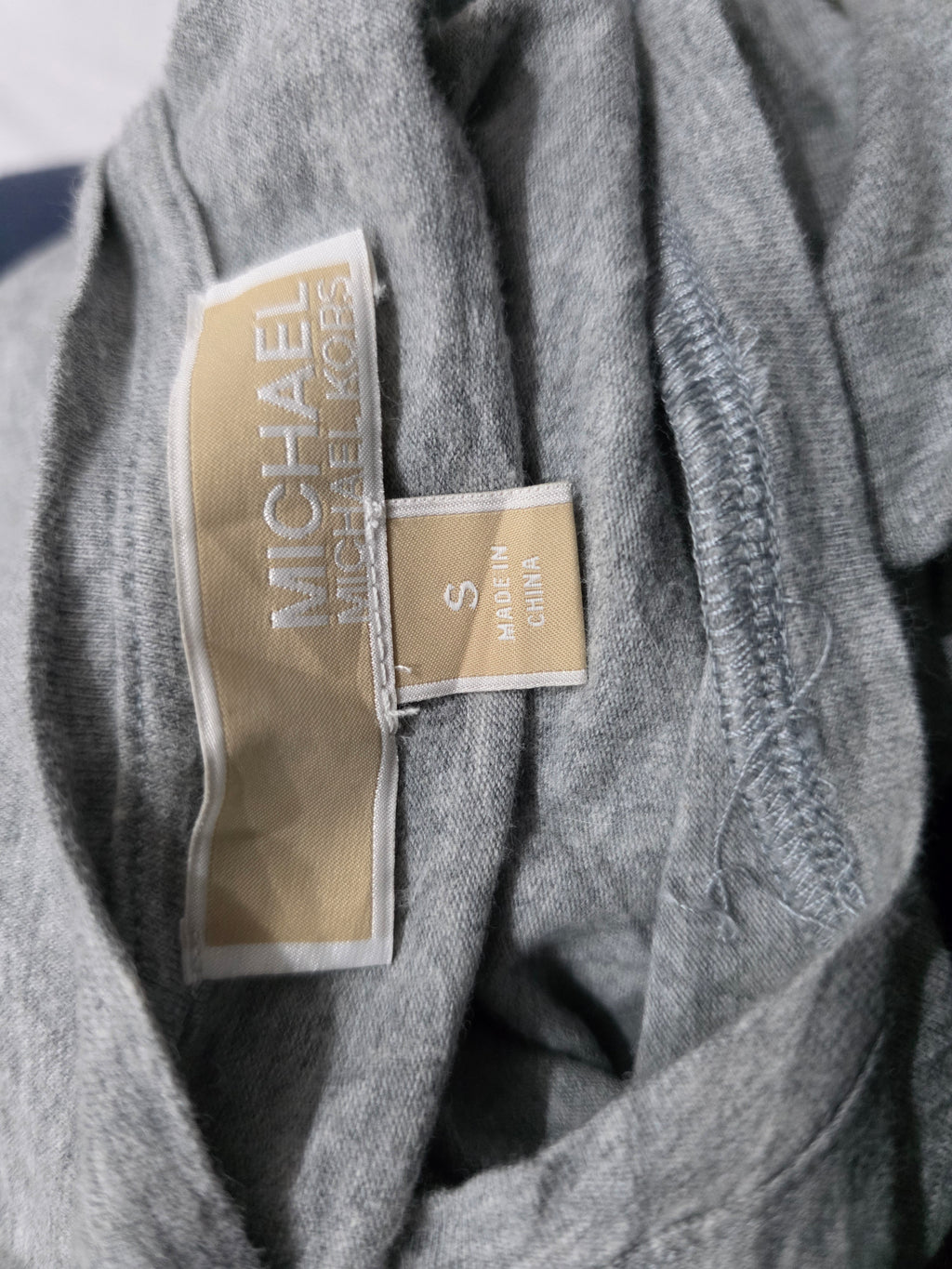Playera sin mangas Michael Kors de Muker color fris con cierres