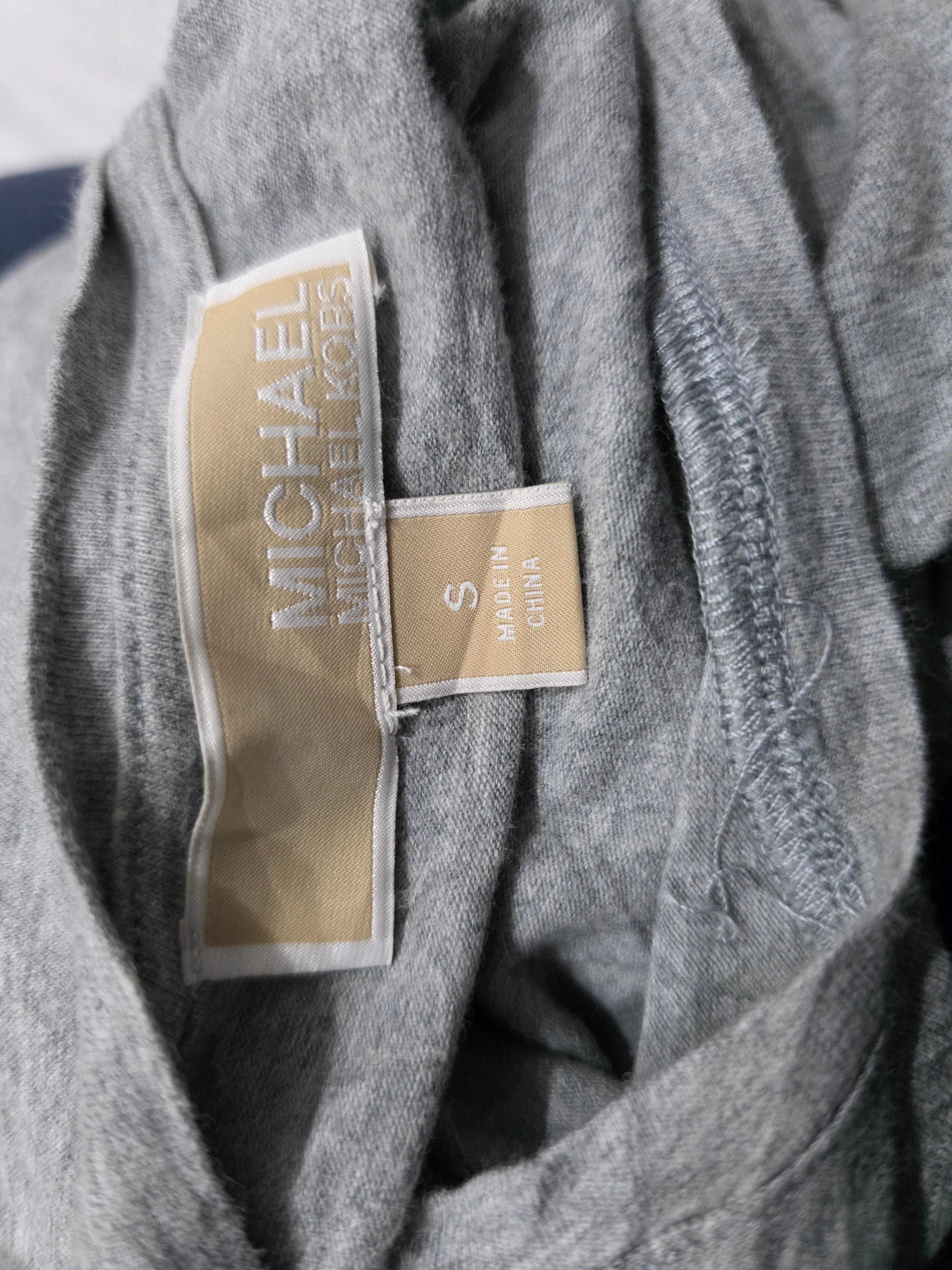 Playera sin mangas Michael Kors de Muker color fris con cierres
